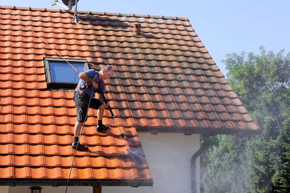 Roof cleaning with high pressure cleaner